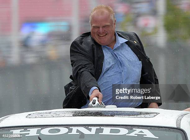 Toronto mayor Rob Ford goes around the track on a parade lap before race 1 of the Verizon IndyCar Series Honda Indy Toronto on the streets of Toronto...