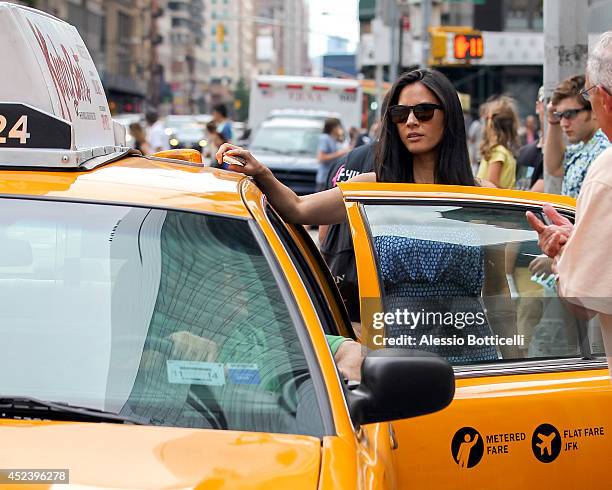 Olivia Munn is seen filming HBO's "The Newsroom" at Bryant Park on July 19, 2014 in New York City.