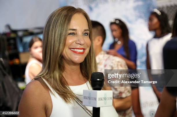 Designer Monica Wise is interviewed backstage at the L*Space By Monica Wise fashion show during Mercedes-Benz Fashion Week Swim 2015 at Cabana Grande...