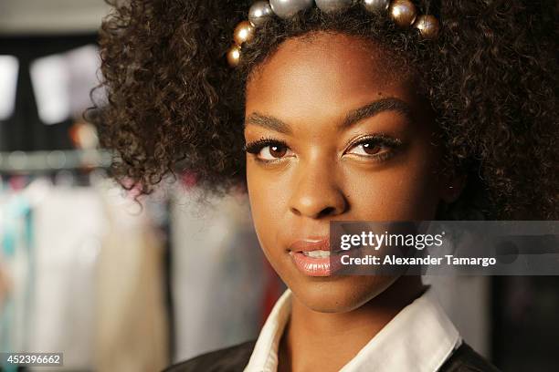Model prepares backstage at the L*Space By Monica Wise fashion show during Mercedes-Benz Fashion Week Swim 2015 at Cabana Grande at The Raleigh on...