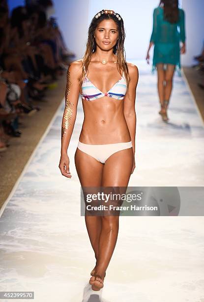 Model walks the runway at the L*Space By Monica Wise fashion show during Mercedes-Benz Fashion Week Swim 2015 at The Raleigh at Raleigh Hotel on July...