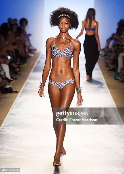 Model walks the runway at the L*Space By Monica Wise fashion show during Mercedes-Benz Fashion Week Swim 2015 at The Raleigh at Raleigh Hotel on July...