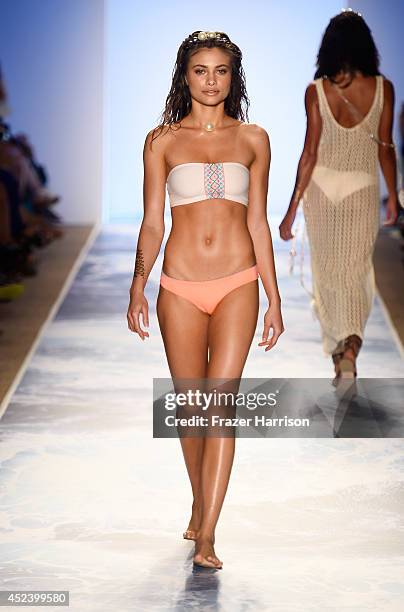 Model walks the runway at the L*Space By Monica Wise fashion show during Mercedes-Benz Fashion Week Swim 2015 at The Raleigh at Raleigh Hotel on July...