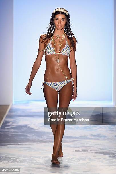 Model walks the runway at the L*Space By Monica Wise fashion show during Mercedes-Benz Fashion Week Swim 2015 at The Raleigh at Raleigh Hotel on July...