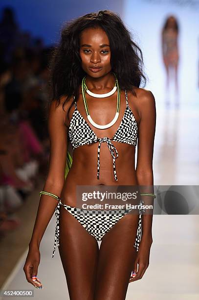 Model walks the runway at the Mara Hoffman Swim fashion show during Mercedes-Benz Fashion Week Swim 2015 at Cabana Grande at The Raleigh on July 19,...