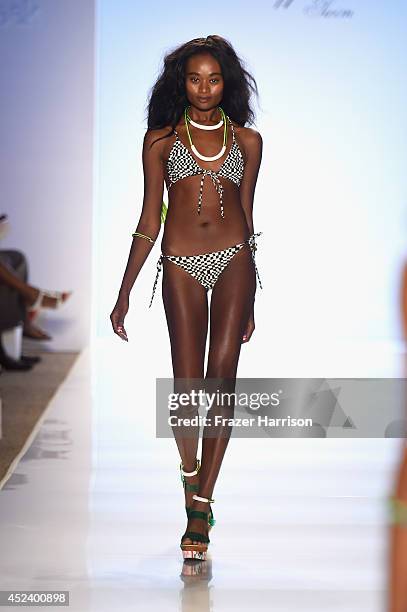 Model walks the runway at the Mara Hoffman Swim fashion show during Mercedes-Benz Fashion Week Swim 2015 at The Raleigh at Raleigh Hotel on July 19,...