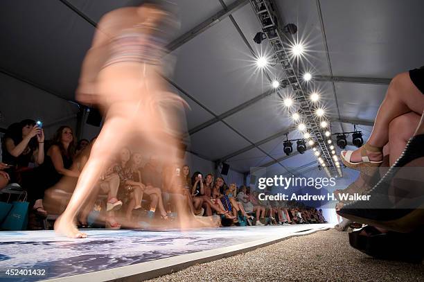 Model walks the runway at the L*Space By Monica Wise fashion show during Mercedes-Benz Fashion Week Swim 2015 at The Raleigh on July 19, 2014 in...