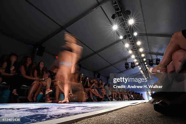 Model walks the runway at the L*Space By Monica Wise fashion show during Mercedes-Benz Fashion Week Swim 2015 at The Raleigh on July 19, 2014 in...