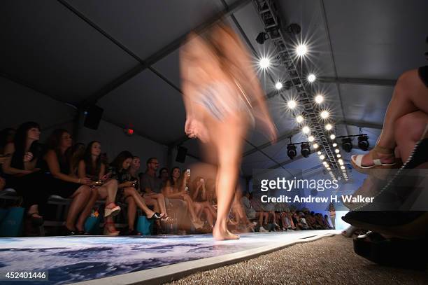 Model walks the runway at the L*Space By Monica Wise fashion show during Mercedes-Benz Fashion Week Swim 2015 at The Raleigh on July 19, 2014 in...