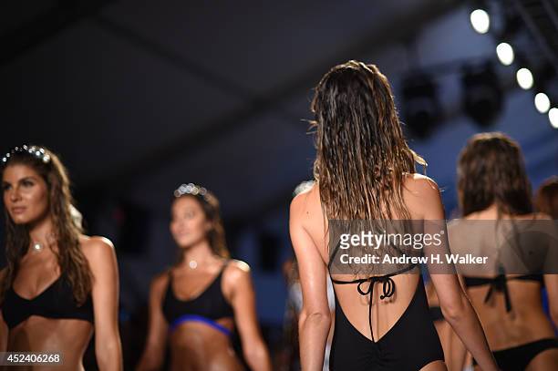 Model walks the runway at the L*Space By Monica Wise show during Mercedes-Benz Fashion Week Swim 2015 at The Raleigh on July 19, 2014 in Miami Beach,...
