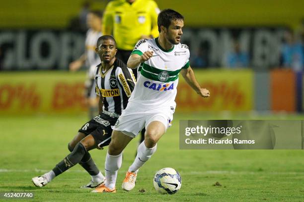 Junior Cesar of Botafogo strugles for the ball with Norberto of Coritiba during the match between Botafogo and Coritiba for the Brazilian Series A...