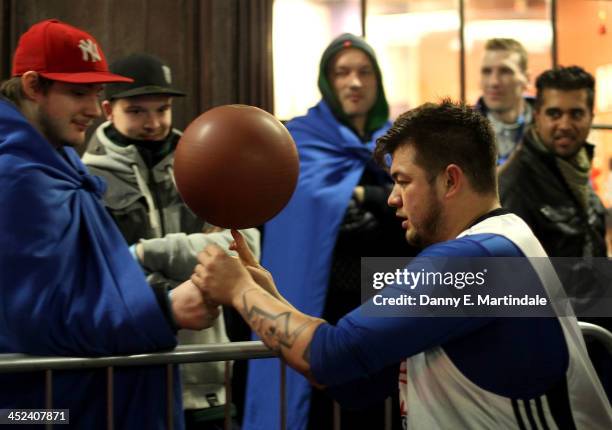 Basketball players entertain queuing gaming fans in Covent Garden ahead of the launch of the Playstation 4 on November 28, 2013 in London, England....