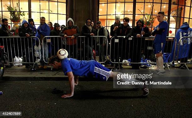 Footballer entertains the queue of gaming fans in Covent Garden ahead of the launch of the Playstation 4 on November 28, 2013 in London, England. PS4...