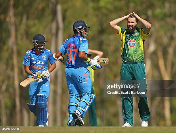 Kane Richardson of Australia A reacts after being hit for a boundary by Robin Uthappa of India A during the Quadrangular One Day Series match between...