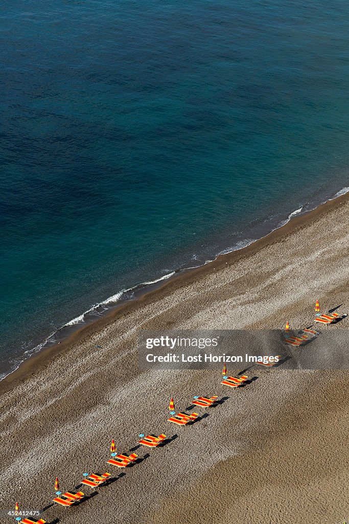 Empty beach chairs on Positano beach, on the Amalfi Peninsula, Campania, Italy