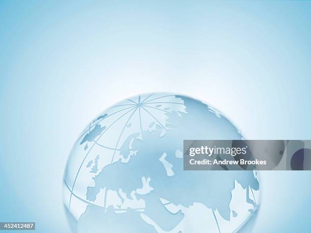 glass sphere representing europe, russia, middle east, china and india - mundo de cristal fotografías e imágenes de stock