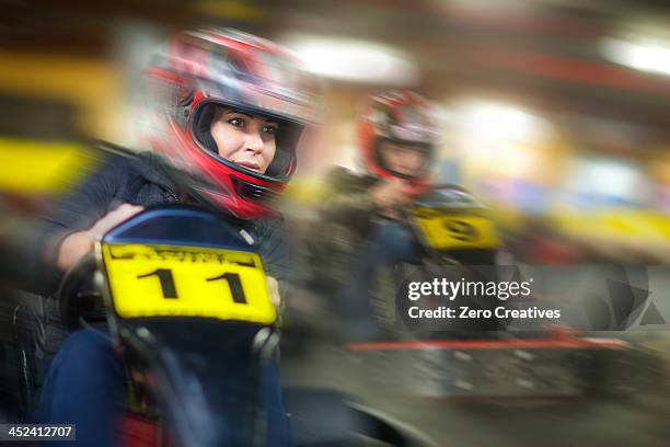 woman racing in go cart - go karts stock pictures, royalty-free photos & images