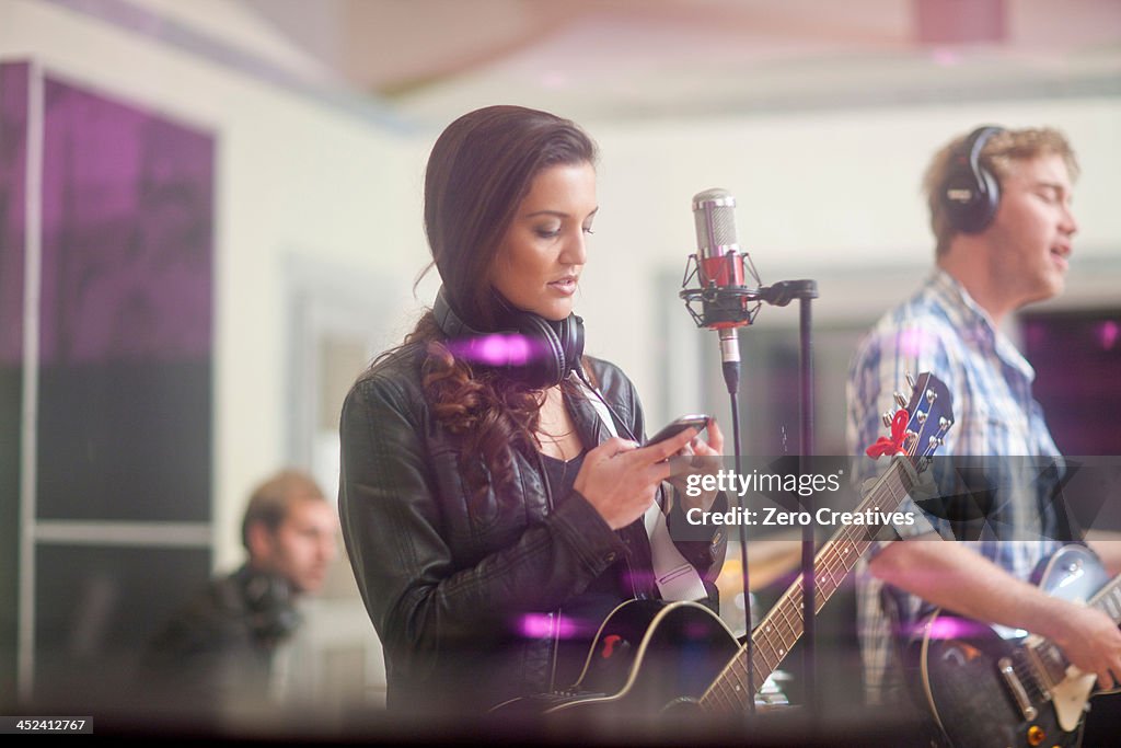 Young band in recoding studio