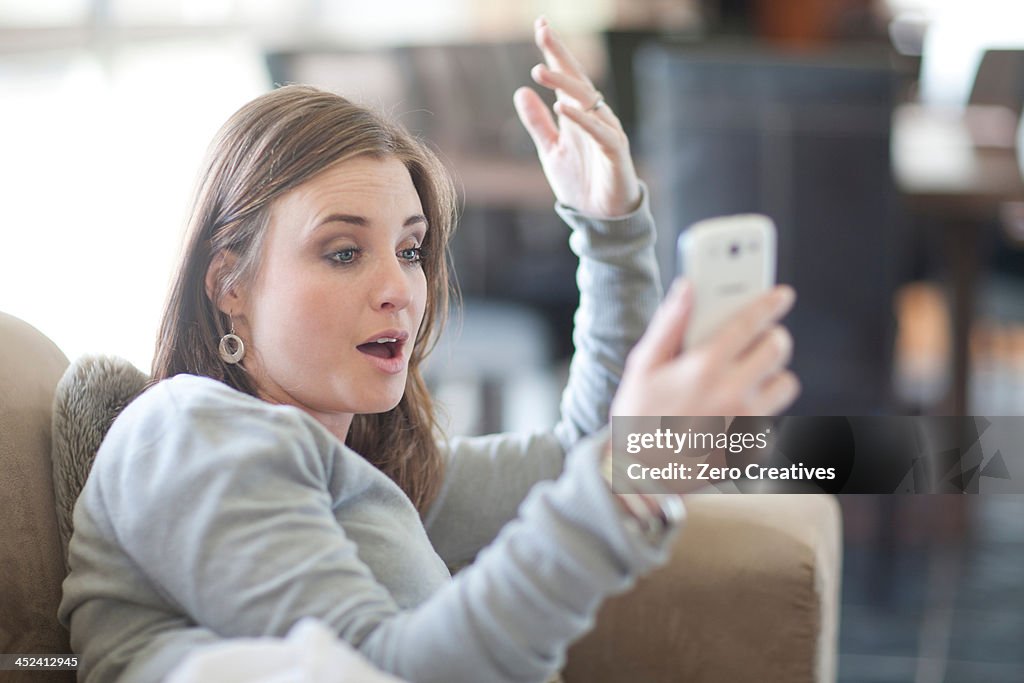 Young woman using cellphone for video call