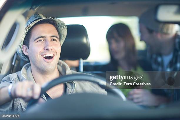 young adult friends driving in car - friends inside car stock-fotos und bilder