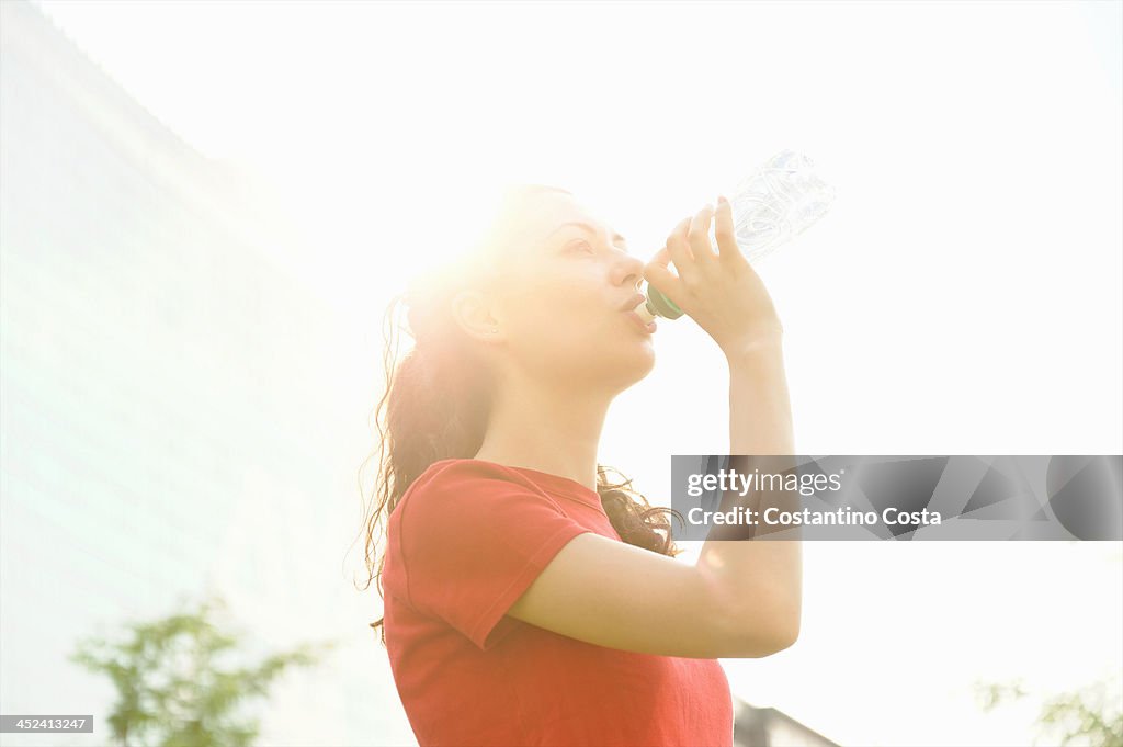 Young woman taking a break from training