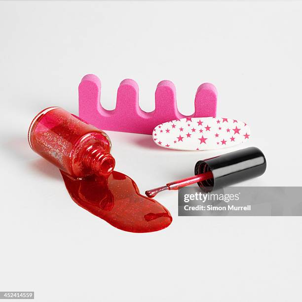 toe separators and red nail varnish - toe separators stock pictures, royalty-free photos & images