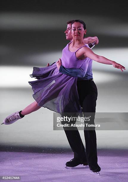 Mao Asada of Japan and Jeffrey Buttle of Canada perform their routine during THE ICE 2014 at the White Ring on July 19, 2014 in Nagano, Japan.