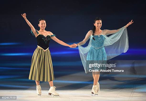 Mao Asada and Mai Asada of Japan perform their routine during THE ICE 2014 at the White Ring on July 19, 2014 in Nagano, Japan.