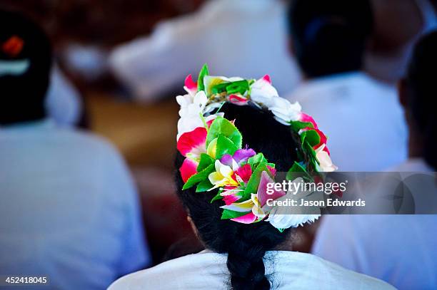a girl with her hair adorned with a garland of flowers for a fatele ceremony. - fiji flower stock pictures, royalty-free photos & images