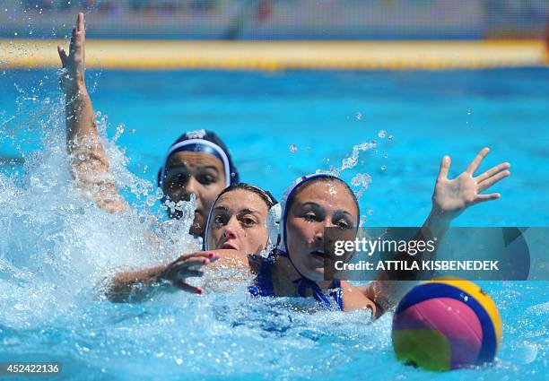 France's Charlaine Clomes and Louise Guillet fight for the ball with Russia's Elvina Karimova during the women's Water Polo European Championships...