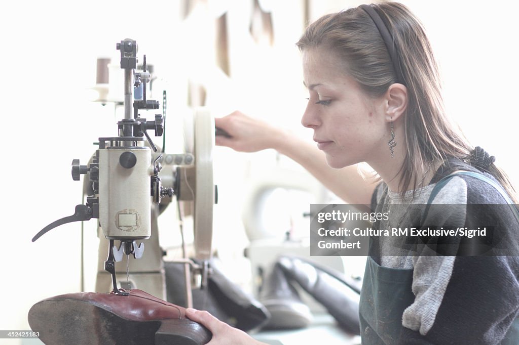 Female cobbler in workshop