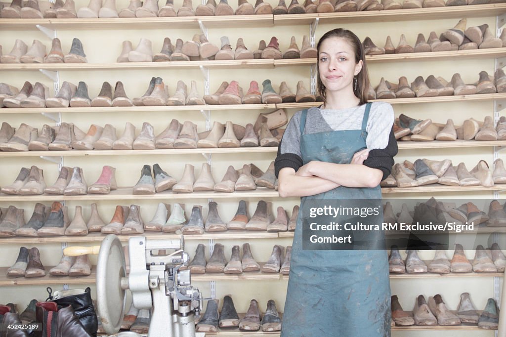 Female cobbler in workshop