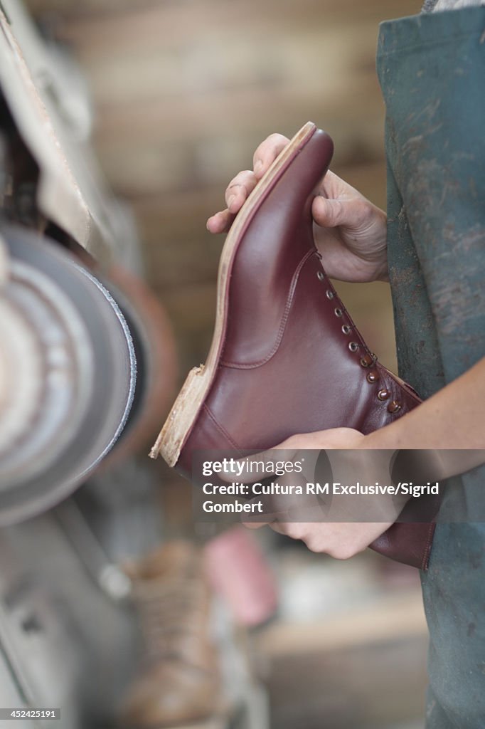 Female cobbler in workshop