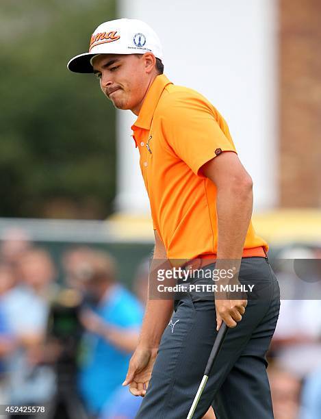 Golfer Rickie Fowler reacts after missing his putt on the 1st green during his fourth round, on the final day of the 2014 British Open Golf...