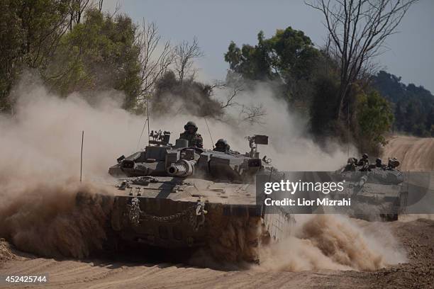 Israeli tanks move along the border on July 20, 2014 on the Israel/Gaza Strip border. Protests have taken place all around the world against Israel's...