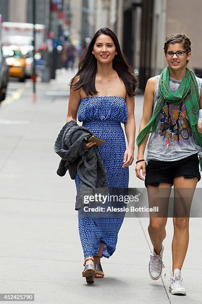 Olivia Munn is seen on location in Times Square for "The Newsroom" on July 19, 2014 in New York City.