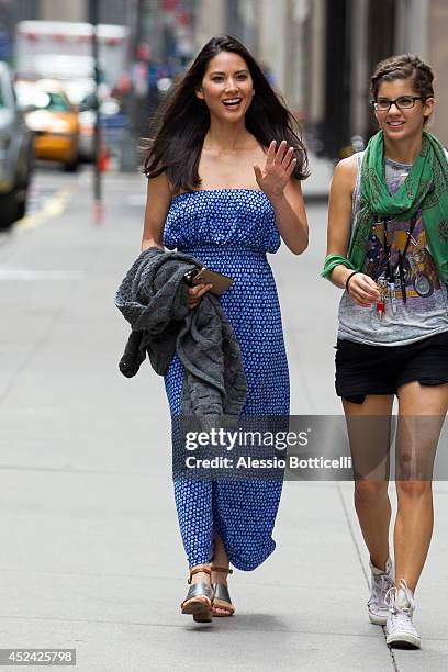 Olivia Munn is seen on location in Times Square for "The Newsroom" on July 19, 2014 in New York City.