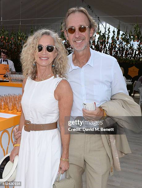 Angie Rutherford and Mike Rutherford attend the Veuve Clicquot Gold Cup Final at Cowdray Park Polo Club on July 20, 2014 in Midhurst, England.