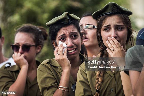 Israeli soldiers weep at the grave of Israeli Sergeant Adar Barsano during his funeral on July 20, 2014 in Nahariya, Israel. Sergeant Barsano was...