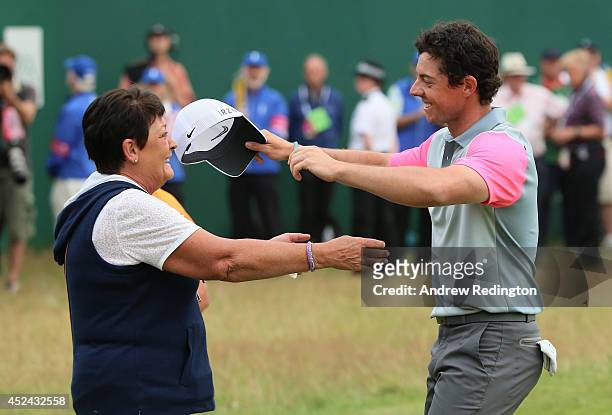 Rory McIlroy of Northern Ireland celebrates his two-stroke victory on the 18th green with his mother Rosie during the final round of The 143rd Open...
