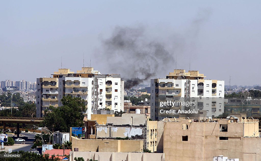 Smoke rising around the Tripoli Airport following clashes in Libya