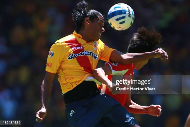 Joel Huiqui of Morelia struggles for the ball with Lucas Lobos of Toluca during a match between Toluca and Morelia as part of 1st round Apertura 2014...