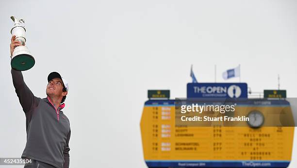 Rory McIlroy of Northern Ireland holds the Claret Jug aloft after his two-stroke victory at The 143rd Open Championship at Royal Liverpool on July...