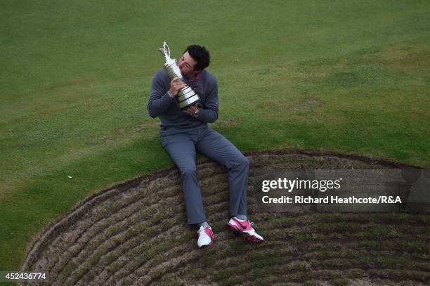 Rory McIlroy of Northern Ireland celebrates with the Claret Jug after his two-stroke victory after the final round of The 143rd Open Championship at...