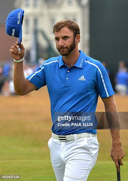 Golfer Dustin Johnson reacts on the 18th green after his fourth round 72, on the final day of the 2014 British Open Golf Championship at Royal...