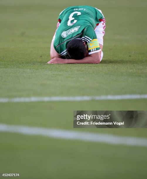 Lucio of Palmeiras is injured during the match between Palmeiras and Cruzeiro for the Brazilian Series A 2014 at Estadio do Pacaembu on July 20, 2014...