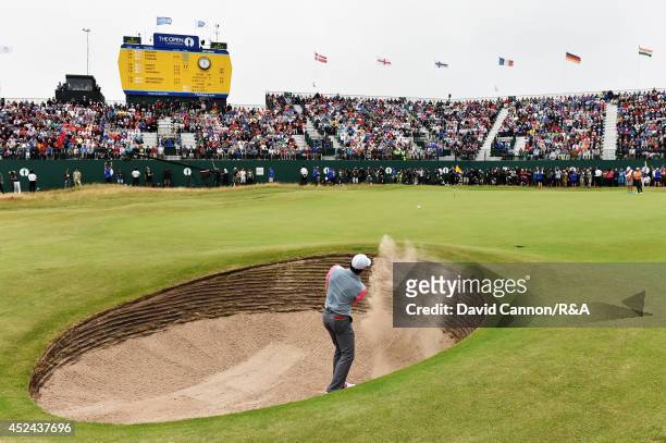 Rory McIlroy of Northern Ireland plays his third shot out of the bunker on the 18th hole during the final round of The 143rd Open Championship at...