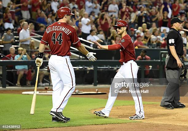 Ender Inciarte and teammate Paul Goldschmidt of the Arizona Diamondbacks celebrate scoring a sixth inning run against the Chicago Cubs at Chase Field...