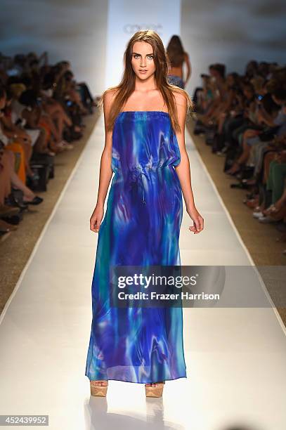 Model walks the runway during Caffe Swimwear show at Mercedes-Benz Fashion Week Swim 2015 at Cabana Grande at The Raleigh on July 20, 2014 in Miami,...