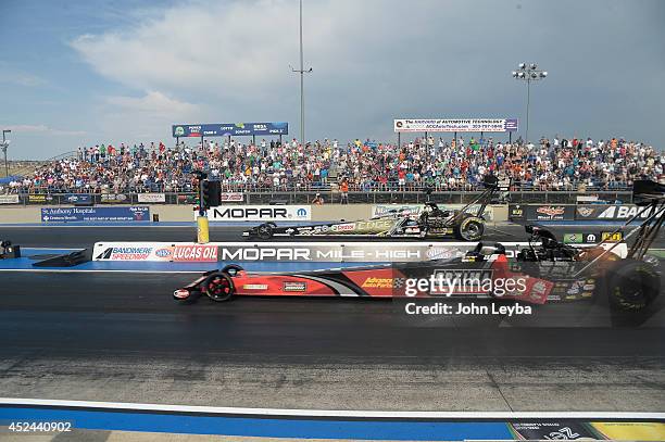 Todd near lane defeats Brittany Force to capture the Top Fuel title during the MOPAR Mile High Nationals July 20, 2014 at Bandimere Speedway.